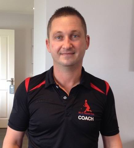 Jason loves playing squash – and coaching youngsters too!